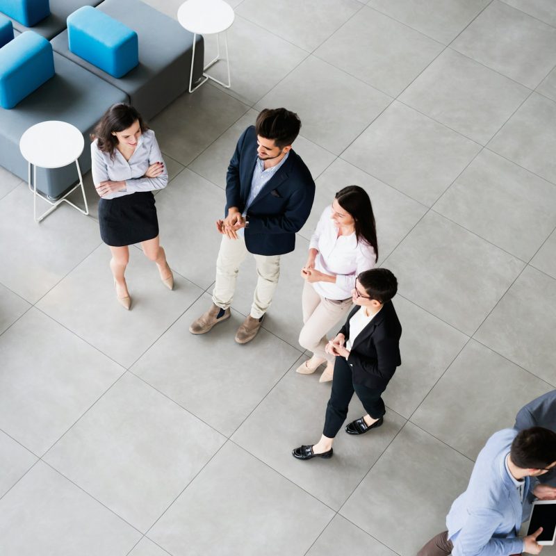 Corporate teamworking colleagues in bright modern office